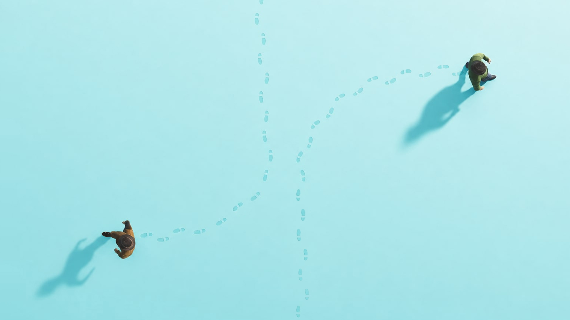 Aerial view of two tiny figures walking in opposite directions across a pale blue field, each leaving a long trail of footprints — the twin breadcrumb trails of prototype-driven development: the spec running forward and telemetry running backward.